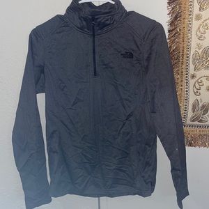 Dark grey north face pullover with front zipper.